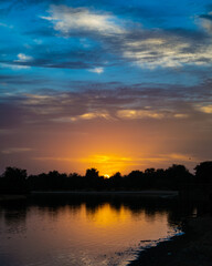 Fototapeta premium Sunrise over the river at Qudra Lake