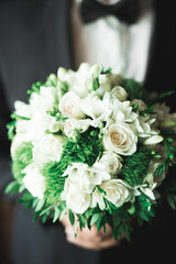 Beautiful wedding bouquet with different flowers, roses