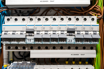 Single-phase fuses in the OFF and ON position and three-phase fuses in the OFF position, placed in...