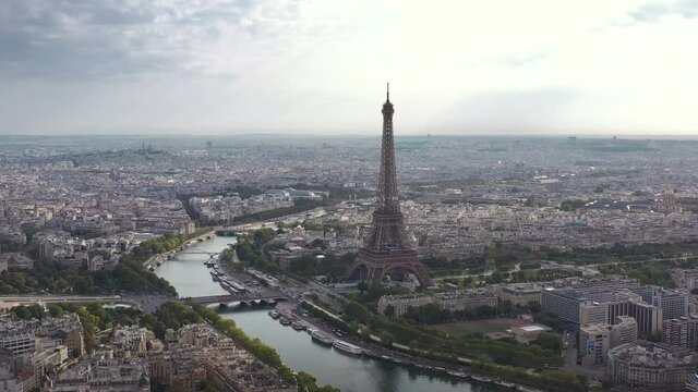 cloudy day flight over paris city center famous tower riverside aerial panorama 4k france