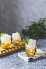 Classic Kentucky derby cocktail the mint julep isolated on light gray table surface - obrazy, fototapety, plakaty