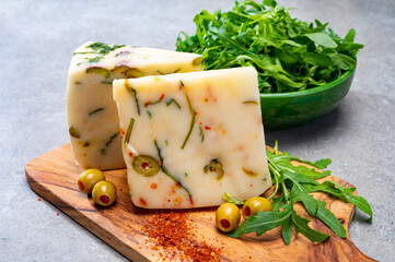 Cheese collection, fresh Italian pecorino cheese made from sheep milk filled with green olives...