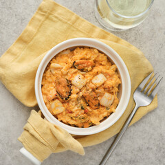 Risotto with seafood on a gray background, top view.