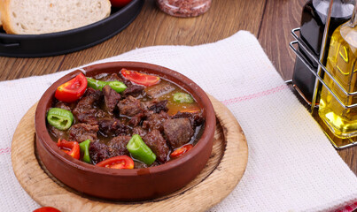 Roasting meat cooked in stone oven and casserole