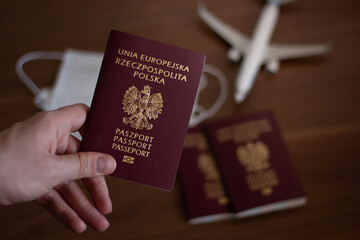 Concept of travelling during the coronavirus pandemic. Closeup of a passport, protective masks and...