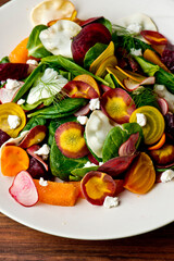 Beet salad. Classic Italian salad with beets, mozzarella, spinach, arugula, Parmesan cheese, olive oil, lemon juice, salt and pepper. A Fine dining restaurant classic.
