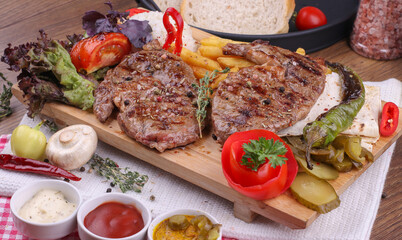 grilled beef entrecote with fried potatoes, rice and salad
