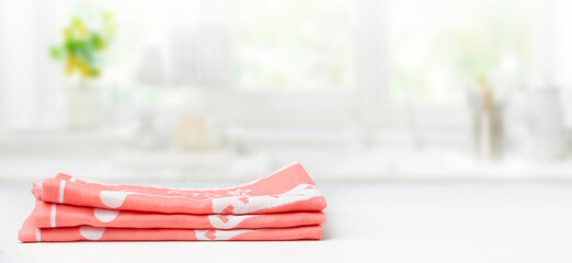 Stack of towels on white table