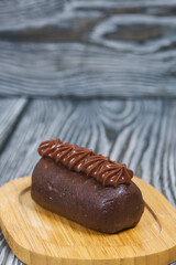 Potato cake. Decorated with chocolate cream.