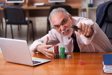 Businessman in the office playing games
