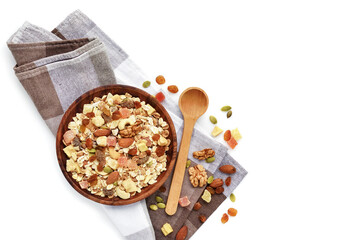 A wooden bowl  Muesli with fruit and nut and a spoon isolated on white background. Healthy breakfast composition with copy space. Top view
