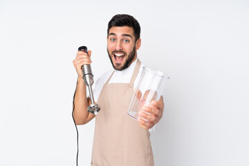 Man using hand blender isolated on white background