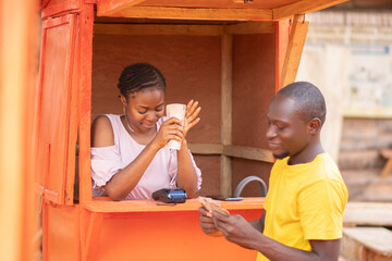 nigerian man using a pos service to withdraw money