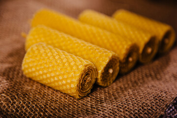 Yellow beeswax candle. A beautiful eco souvenir made from natural products.