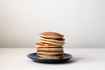 Stack of American pancakes on a blue plate
