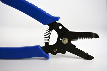 Metal plassentes with blue plastics handles for trimming wires of different diameter located on a...