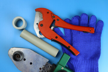 Plumbing tools on a blue background