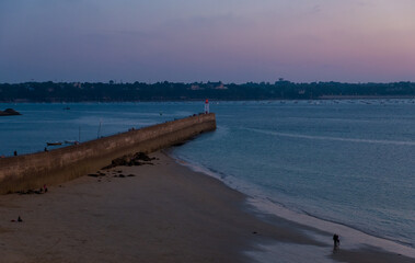 Fototapeta premium View of the jetty and the lighthouse in Saint-Malo