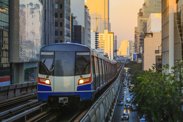 Naklejka premium BTS Sky Train is running in downtown of Bangkok. Sky train is fastest transport mode in Bangkok