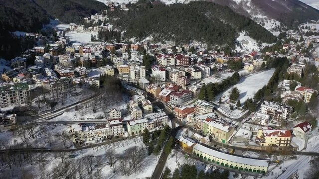 Roccaraso, a delightful village in Abruzzo covered in snow
Mountain town with snow. Aerial shot with drone