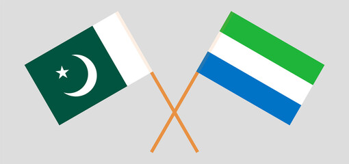 Crossed flags of Pakistan and Sierra Leone. Official colors. Correct proportion