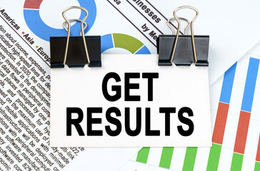 Among the reporting charts and diagrams is a plate with the inscription - GET RESULTS