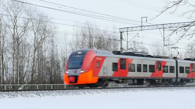 St. Petersburg, Russia, January 19, 2020  Russian Railways electric train swallow is passing by in winter