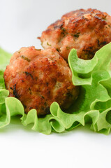 meatballs on a lettuce leaf, isolated, selective focus macro