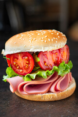 sandwich sausage and tomatoes vegetables burger jamon ham meat portion on the table meal snack outdoor top view copy space for text food background rustic image