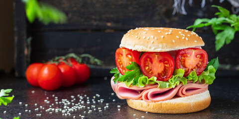 sandwich sausage and tomatoes vegetables burger jamon ham meat portion on the table meal snack outdoor top view copy space for text food background rustic image