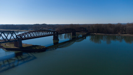 Bridge at summer with a blue sky in the Horizon . The picture was taken by a drone. the River unter the Bridge called Rhein.  