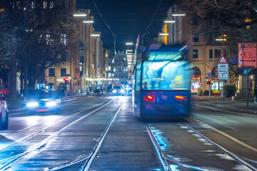 Naklejka na ściany i meble Munich night street traffic time lapse video in 4k.