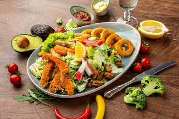 Seafood and vegetable salad. Shrimps, mussels, squid rings