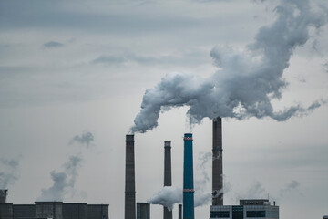 Air pollution concept - smoke from chimneys of power plant