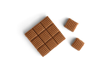 Chocolate toffee candy squares isolated on white background. Top view.