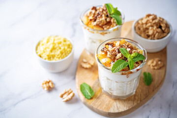 Greek yogurt millet caramelized apple walnuts parfait in a glass