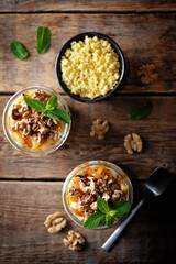 Greek yogurt millet caramelized apple walnuts parfait in a glass