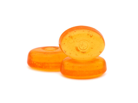 Orange hard candy isolated on white 