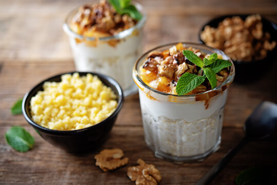 Greek yogurt millet caramelized apple walnuts parfait in a glass