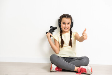 Girl using video game controller Isolated on white background © Angelov