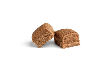 Chocolate toffee candy squares isolated on white background.