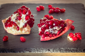juicy pomegranate. Natural appearance in the kitchen, pieces of fruit healthy and full of vitamins