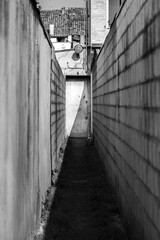 White door at the end of a long and narrow street
