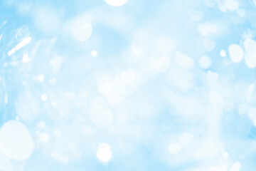 Abstract blue pastel bokeh lights background.