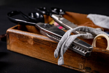 Scissors on the table in the tailor's workshop. Accessories necessary for tailoring.