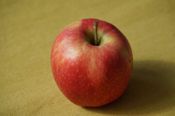 Healthy food. A single red apple.