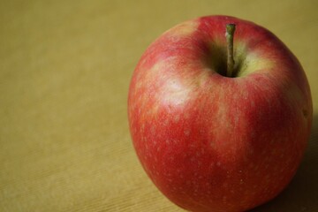 Healthy food. A single red apple.