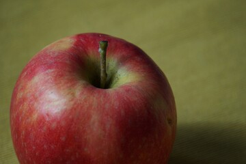 Healthy food. A single red apple.