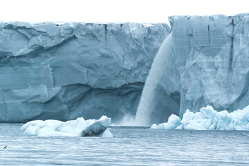 Svalbard, Nordaustlandet Island. Waterfalls cascade from the melting glacier. © Danita Delimont
