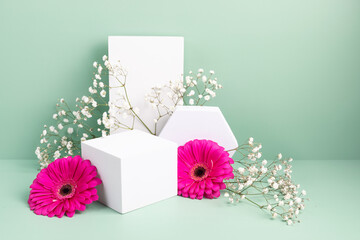 Podium, stand for product presentation and spring flowers. Mockup for branding and festive packaging presentation
